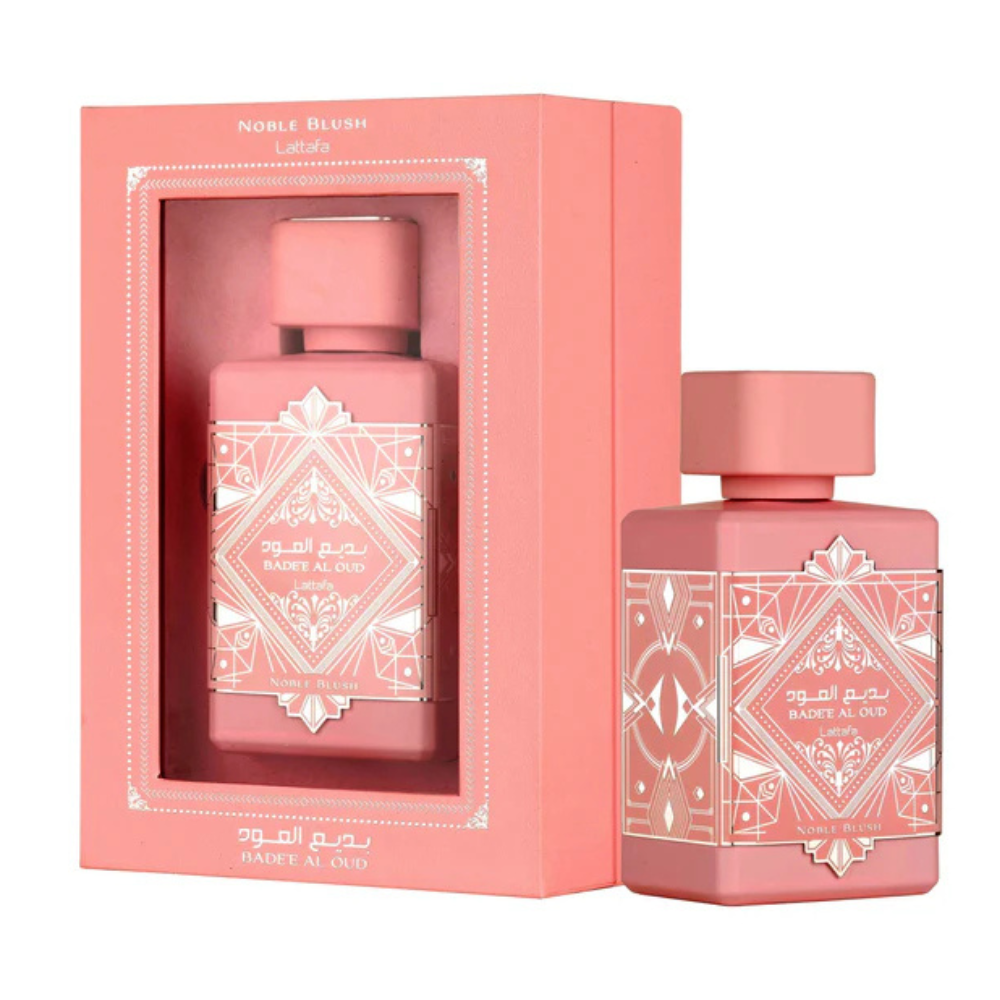 Pink perfume bottle with decorative design and matching pink packaging on a white background