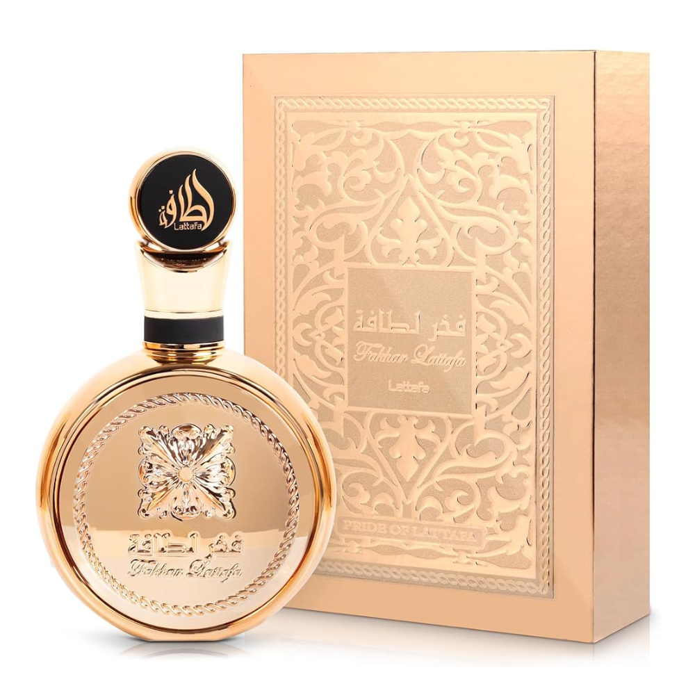 Gold perfume bottle and packaging with intricate designs on a white background