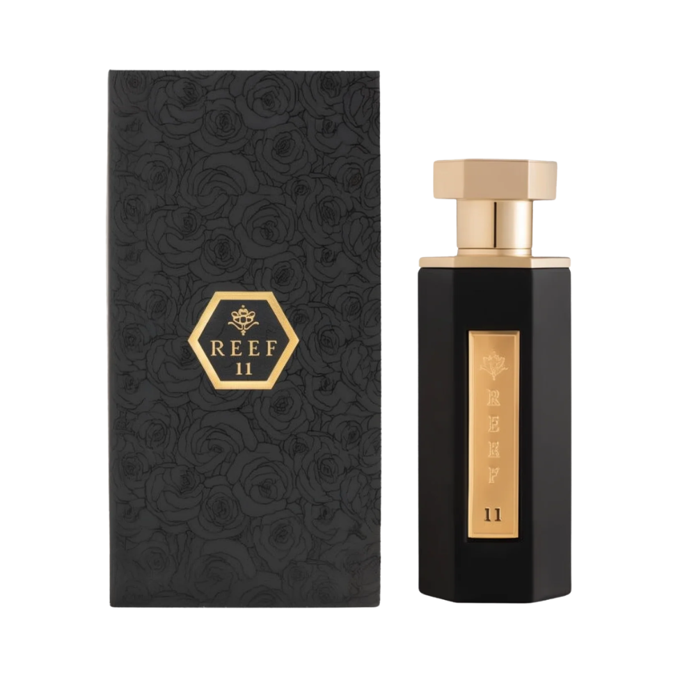 Black and gold perfume bottle with matching box featuring 'REEF II' branding on a white background.