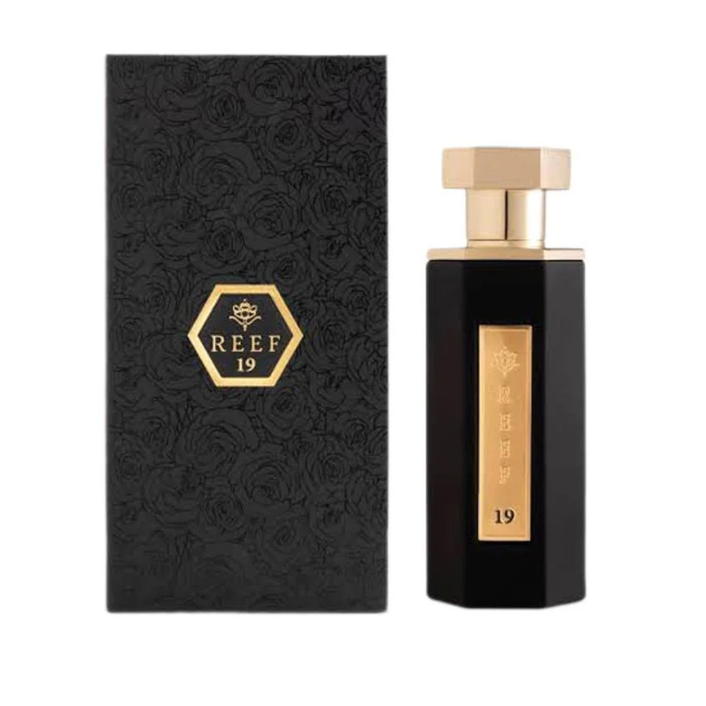 Black perfume bottle and packaging with 'REEF 19' branding on a white background