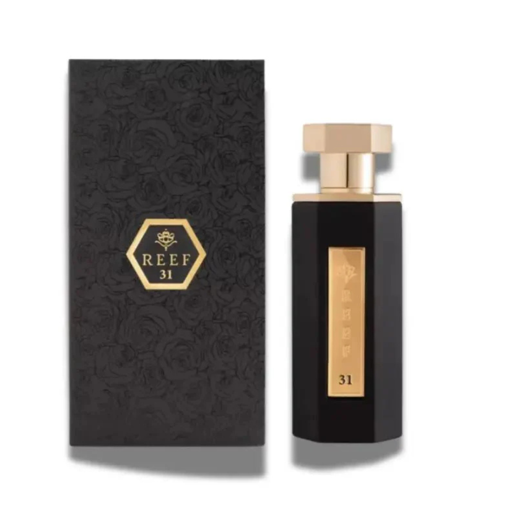 Black perfume bottle and packaging with 'REEF 31' branding on a white background