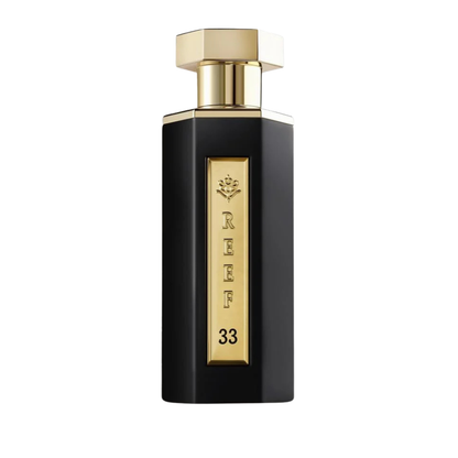 Black and gold perfume bottle with 'REEF 33' branding on a white background