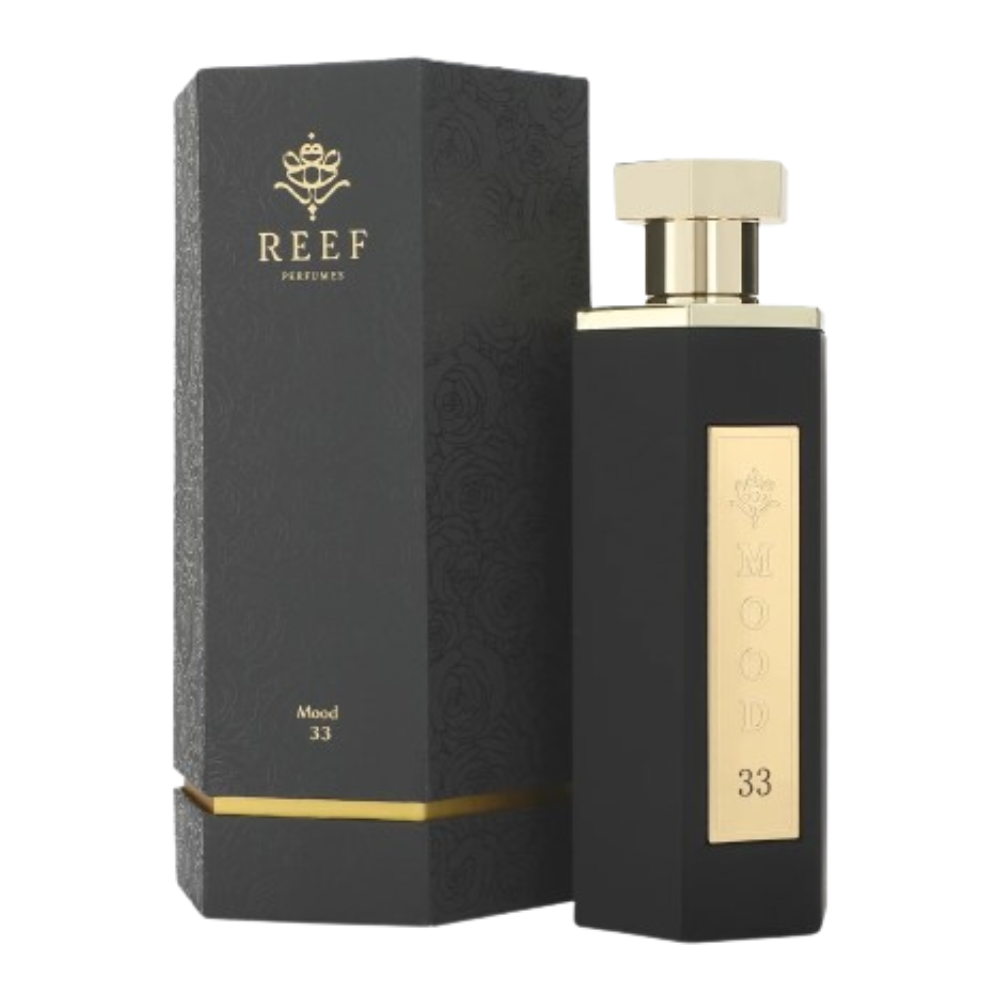 Black perfume bottle with gold accents and matching packaging on a white background