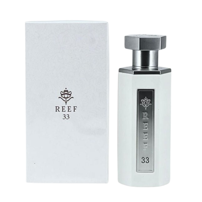 White perfume bottle and box with 'REEF 33' branding on a white background