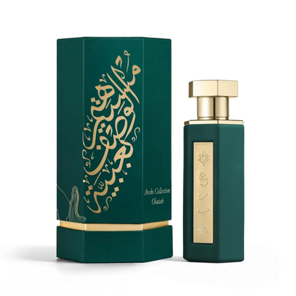Green perfume bottle and packaging with gold accents on a white background
